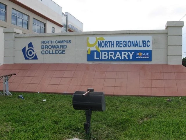 panels attached to monument sign. Broward College Library.