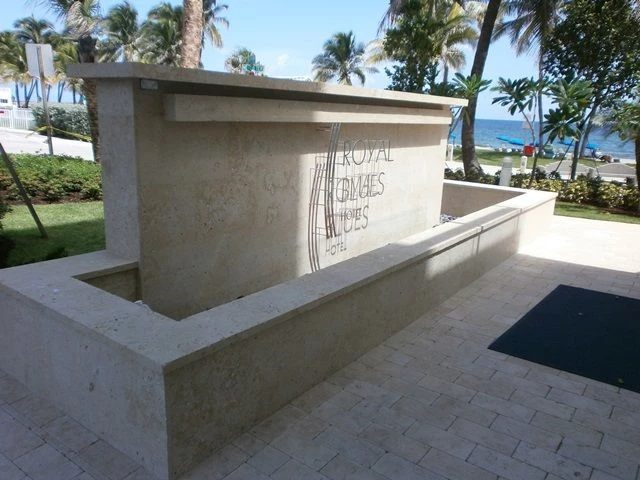 Metal lettering mounted on a monument sign for hotel. 